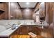 A butler's pantry showcases dark wood cabinetry and plenty of countertop space at 639 John Anderson Dr, Ormond Beach, FL 32176