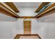 A walk-in closet with multiple wood racks for storage at 639 John Anderson Dr, Ormond Beach, FL 32176