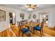 An inviting dining room featuring hardwood floors, classic decor, and great natural light at 639 John Anderson Dr, Ormond Beach, FL 32176