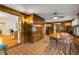 View of the dining room from the doorway, showing wood paneling and brick flooring at 639 John Anderson Dr, Ormond Beach, FL 32176