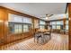 Wood paneled dining room with large windows, and brick floors at 639 John Anderson Dr, Ormond Beach, FL 32176