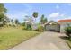 A long driveway leads to this well-manicured home with mature landscaping at 639 John Anderson Dr, Ormond Beach, FL 32176