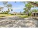 Beautiful home with a lush lawn, screened-in pool, and mature trees, perfect for outdoor living at 639 John Anderson Dr, Ormond Beach, FL 32176