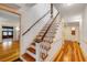Inviting foyer featuring hardwood floors and staircase, offering a warm welcome at 639 John Anderson Dr, Ormond Beach, FL 32176