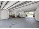 The spacious garage features white walls and ceilings, and an overhead fan at 639 John Anderson Dr, Ormond Beach, FL 32176