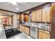 A kitchen features wood cabinets, stainless steel appliances, and a tile floor at 639 John Anderson Dr, Ormond Beach, FL 32176