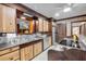 A kitchen features wood cabinets, stainless steel appliances, and a tile floor at 639 John Anderson Dr, Ormond Beach, FL 32176