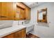 Functional laundry room with ample counter space, wooden cabinets, and bright, tiled walls at 639 John Anderson Dr, Ormond Beach, FL 32176
