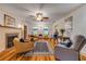Inviting living room with a fireplace, hardwood floors and abundant natural light at 639 John Anderson Dr, Ormond Beach, FL 32176