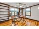 Office room featuring wood floors and built in bookshelves at 639 John Anderson Dr, Ormond Beach, FL 32176