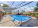 This screened-in pool area features comfortable seating and is ready for entertaining at 639 John Anderson Dr, Ormond Beach, FL 32176