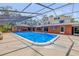 This screened-in pool area features comfortable seating and is ready for entertaining at 639 John Anderson Dr, Ormond Beach, FL 32176