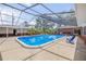 This screened-in pool area features comfortable seating and is ready for entertaining at 639 John Anderson Dr, Ormond Beach, FL 32176