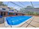 This screened-in pool area features comfortable seating and is ready for entertaining at 639 John Anderson Dr, Ormond Beach, FL 32176