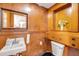 Cozy powder room with wooden accents, built-in cabinet, and vintage style provides charm at 639 John Anderson Dr, Ormond Beach, FL 32176