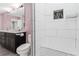 Updated bathroom boasts dual sinks, shower, tiled seat, and glass doors at 6402 Beechnut Dr, Lakeland, FL 33813