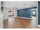 Spacious living area featuring wood floors, neutral walls, and sliding glass doors at 6402 Beechnut Dr, Lakeland, FL 33813