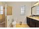 Clean bathroom with a glass-enclosed shower, tile flooring, and modern fixtures at 741 Mystic Oaks Ln, Deland, FL 32724