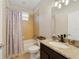 Bathroom with a shower-tub combo, granite vanity, and neutral-toned finishes at 741 Mystic Oaks Ln, Deland, FL 32724