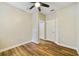 Bedroom with wood flooring, white trim, and neutral colored walls at 741 Mystic Oaks Ln, Deland, FL 32724