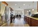 Modern kitchen boasts stainless steel appliances, granite countertops, and stylish pendant lighting at 741 Mystic Oaks Ln, Deland, FL 32724