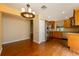 Kitchen and dining area featuring stainless steel appliances and hardwood floors at 7423 Elsworth Ct, Orlando, FL 32819
