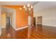 Open-concept living space showcasing hardwood floors and elegant design at 7423 Elsworth Ct, Orlando, FL 32819