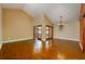 Spacious living room with hardwood floors and a cozy chandelier at 7423 Elsworth Ct, Orlando, FL 32819