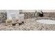Close-up of bathroom vanity featuring a granite countertop and luxury toiletries at 7487 Oakmoss Loop, Davenport, FL 33837