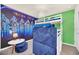 bedroom with Star Wars mural and white bunk beds at 7487 Oakmoss Loop, Davenport, FL 33837