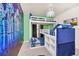 Bedroom featuring bunk beds, a built in bookcase and a Star Wars themed mural at 7487 Oakmoss Loop, Davenport, FL 33837
