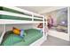 bedroom featuring white bunk beds and a colorful mural at 7487 Oakmoss Loop, Davenport, FL 33837