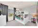 bedroom features a white bunk bed, plush toys, window view and Disney themed wallpaper at 7487 Oakmoss Loop, Davenport, FL 33837