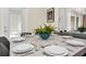Elegant dining room with stylish decor and access to the backyard pool area at 7487 Oakmoss Loop, Davenport, FL 33837