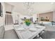 Dining room showcasing modern design elements and open floor plan leading into the living room and kitchen at 7487 Oakmoss Loop, Davenport, FL 33837