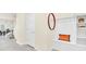 Welcoming foyer with storage bench, decorative mirror, and view of the staircase at 7487 Oakmoss Loop, Davenport, FL 33837