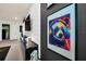 Unique wall art in game zone with TV and gaming-themed decor at 7487 Oakmoss Loop, Davenport, FL 33837