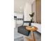 Modern living room chair with accent decor is conveniently placed near the gourmet kitchen at 7487 Oakmoss Loop, Davenport, FL 33837