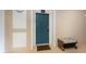 Inviting condo front door, with welcome mat and a bench, offering a warm entrance at 7654 Comrow St # 104, Kissimmee, FL 34747