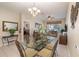 Cozy condo living space featuring tile flooring, a ceiling fan, and lots of natural light at 7654 Comrow St # 104, Kissimmee, FL 34747