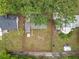 Aerial view of the property featuring a large yard, lush trees, and fence at 810 Catalina Dr, Sanford, FL 32771