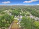 Residential property showcases its expansive yard and backyard pool, nestled within a dense canopy of mature trees at 810 Catalina Dr, Sanford, FL 32771