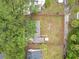 Aerial view of the property featuring a large yard, lush trees, and fence at 810 Catalina Dr, Sanford, FL 32771