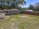 Home features a fenced backyard, a small storage shed, and ample green space for outdoor activities and relaxation at 810 Catalina Dr, Sanford, FL 32771