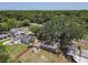 Aerial view of home with fenced yard, mature trees, and shed, showcasing a private and spacious outdoor area at 810 Catalina Dr, Sanford, FL 32771
