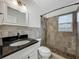 Bathroom features vanity with granite countertop and tiled walk-in shower at 810 Catalina Dr, Sanford, FL 32771