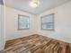 Cozy bedroom with hardwood flooring and two windows at 810 Catalina Dr, Sanford, FL 32771