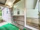 Home's exterior features wood siding; interior living room visible through open door at 810 Catalina Dr, Sanford, FL 32771