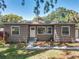 Charming home features a well-maintained front exterior, a welcoming entrance, and lush landscaping at 810 Catalina Dr, Sanford, FL 32771