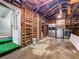Spacious garage with exposed beams, stainless steel refrigerator, washer, and dryer at 810 Catalina Dr, Sanford, FL 32771